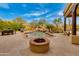 Desert backyard features pool, waterfall, fire pit, and lush desert landscaping at 27171 N 73Rd St, Scottsdale, AZ 85266