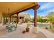 Expansive backyard features a pool, a covered patio, and desert landscaping at 27171 N 73Rd St, Scottsdale, AZ 85266