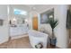 Bright and airy bathroom featuring a soaking tub, modern fixtures, and natural light at 27171 N 73Rd St, Scottsdale, AZ 85266