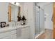Bright bathroom with a glass shower, a sleek vanity, and neutral tones at 27171 N 73Rd St, Scottsdale, AZ 85266