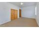 Neutral bedroom space with light carpet and a large closet at 27171 N 73Rd St, Scottsdale, AZ 85266