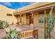 Home's front porch features decorative pillars and desert foliage at 27171 N 73Rd St, Scottsdale, AZ 85266