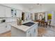 Stylish kitchen featuring an island cooktop, ample counter space, and a view into the breakfast nook at 27171 N 73Rd St, Scottsdale, AZ 85266