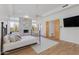Bright main bedroom with a fireplace, plantation shutters, and plenty of natural light at 27171 N 73Rd St, Scottsdale, AZ 85266