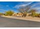 Single-story home with three-car garage and desert landscaping at 27171 N 73Rd St, Scottsdale, AZ 85266