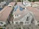 Aerial view of home with solar panels on roof in a neighborhood with tile roofs and manicured landscaping at 3438 E Betsy Ln, Gilbert, AZ 85296