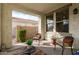 Cozy covered patio featuring comfortable seating, ideal for enjoying the outdoors at 3438 E Betsy Ln, Gilbert, AZ 85296