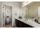 Bathroom with a large mirror, lots of counter space, and a view of the toilet at 3438 E Betsy Ln, Gilbert, AZ 85296