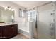 Bathroom with shower and tub, dual sinks, and window at 3438 E Betsy Ln, Gilbert, AZ 85296