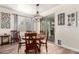 Cozy dining room featuring a round table, stylish chandelier, and easy access to the patio at 3438 E Betsy Ln, Gilbert, AZ 85296