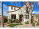 Charming two-story home with a stucco exterior, well-manicured landscaping, and a cozy front porch at 3438 E Betsy Ln, Gilbert, AZ 85296