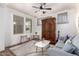 Comfortable living room featuring a ceiling fan, stylish decor, and a cozy seating area at 3438 E Betsy Ln, Gilbert, AZ 85296