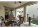 Covered patio with textured columns, sliding glass door and a cozy outdoor seating area at 3438 E Betsy Ln, Gilbert, AZ 85296