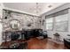 Charming salon space featuring a chandelier, and a cozy chair with a mirror and leafy decor at 3438 E Betsy Ln, Gilbert, AZ 85296
