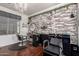 Bright salon with brick accent wall, chandelier, hair washing station, and salon chairs at 3438 E Betsy Ln, Gilbert, AZ 85296
