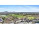 Scenic aerial shot of golf course within community, showcasing green fairways and surrounding desert landscape at 41601 N River Bend Rd, Anthem, AZ 85086