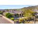 An aerial view of the backyard shows the pool, patio, and lush landscaping, highlighting the perfect outdoor retreat at 41601 N River Bend Rd, Anthem, AZ 85086