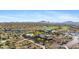 Overhead view displays the community's clubhouse, pool, tennis courts, golf course and vast desert surroundings at 41601 N River Bend Rd, Anthem, AZ 85086
