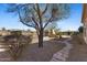 Expansive backyard with stone pathways and desert landscaping at 41601 N River Bend Rd, Anthem, AZ 85086