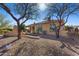 Home exterior showcasing covered patio, desert landscaping, and gravel ground cover at 41601 N River Bend Rd, Anthem, AZ 85086