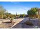 Backyard pool and spa surrounded by desert landscape at 41601 N River Bend Rd, Anthem, AZ 85086