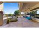 Inviting covered patio with flagstone flooring and a relaxing swing at 41601 N River Bend Rd, Anthem, AZ 85086