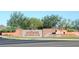 Welcoming entrance to Anthem Country Club featuring a water feature and beautifully landscaped surroundings at 41601 N River Bend Rd, Anthem, AZ 85086