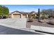 Charming home with a three-car garage, desert landscaping, and a well-maintained yard at 41601 N River Bend Rd, Anthem, AZ 85086