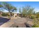 Outdoor fireplace with flagstone patio at 41601 N River Bend Rd, Anthem, AZ 85086