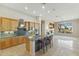 Bright kitchen with a center island, granite countertops, and stainless steel appliances at 41601 N River Bend Rd, Anthem, AZ 85086