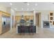 Bright kitchen features granite countertops, stainless steel appliances, and a fireplace creating a warm and inviting space at 41601 N River Bend Rd, Anthem, AZ 85086