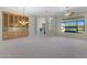 Large living room featuring built-in cabinets, big windows, a ceiling fan, and neutral tones creating an inviting space at 41601 N River Bend Rd, Anthem, AZ 85086