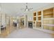 Open floor plan with fireplace, wine rack, kitchen island, and bright natural light at 41601 N River Bend Rd, Anthem, AZ 85086