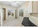 Bright office space with large windows, built-in shelving, and neutral carpet at 41601 N River Bend Rd, Anthem, AZ 85086