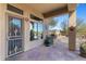 Covered patio with outdoor grill, counterspace and desert decor at 41601 N River Bend Rd, Anthem, AZ 85086