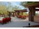 Inviting outdoor lounge area with comfortable seating and shade structures, perfect for relaxation and socializing at 41601 N River Bend Rd, Anthem, AZ 85086