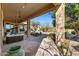 Inviting covered patio boasts a hot tub and outdoor kitchen area, ideal for relaxation and entertaining at 41601 N River Bend Rd, Anthem, AZ 85086