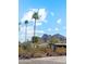 Street view featuring palm trees and glimpses of the houses nestled among desert vegetation at 4165 E Saint Joseph Way, Phoenix, AZ 85018