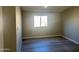 Neutral-toned bedroom features dark wood flooring and a window at 420 S 98Th Way, Mesa, AZ 85208