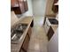 A kitchen featuring white appliances, and dual basin stainless steel sink at 4258 N 68Th Ln, Phoenix, AZ 85033