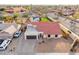 Aerial view of a single-Gathering home showcasing its desert landscaping, pool, and well-maintained exterior at 5607 E Enrose St, Mesa, AZ 85205
