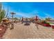 Relaxing backyard featuring a fire pit, and desert landscaping, perfect for outdoor gatherings at 5607 E Enrose St, Mesa, AZ 85205