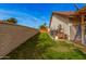 Spacious backyard with lush green lawn and privacy wall, perfect for outdoor activities and relaxation at 5607 E Enrose St, Mesa, AZ 85205