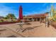 An outdoor patio with a fire pit at 5607 E Enrose St, Mesa, AZ 85205
