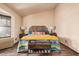 Bright bedroom with wood floors, bay window, and comfortable decor at 5607 E Enrose St, Mesa, AZ 85205