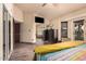 Cozy primary bedroom with closet, wood floors, and sliding glass doors to the outside at 5607 E Enrose St, Mesa, AZ 85205
