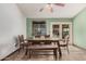 Charming dining area featuring a rustic wooden table, bench seating, and tile flooring at 5607 E Enrose St, Mesa, AZ 85205