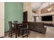 Cozy dining area with a dark wood table and chairs, complemented by neutral wall colors at 5607 E Enrose St, Mesa, AZ 85205