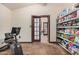 Well organized pantry area with tiled floors, storage racks and convenient access at 5607 E Enrose St, Mesa, AZ 85205