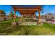 A tranquil backyard showing a pergola structure and inviting walkway at 5607 E Enrose St, Mesa, AZ 85205